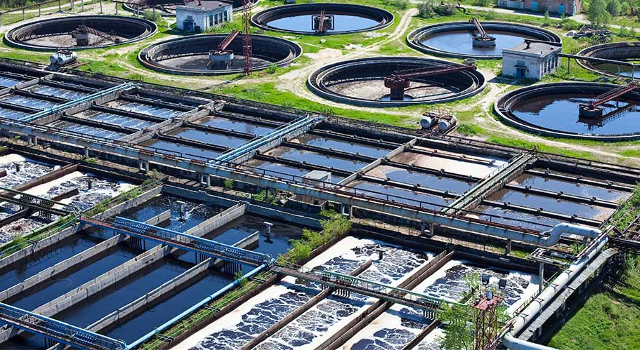 Aerial view of a wastewater treatment plant with circular clarifiers